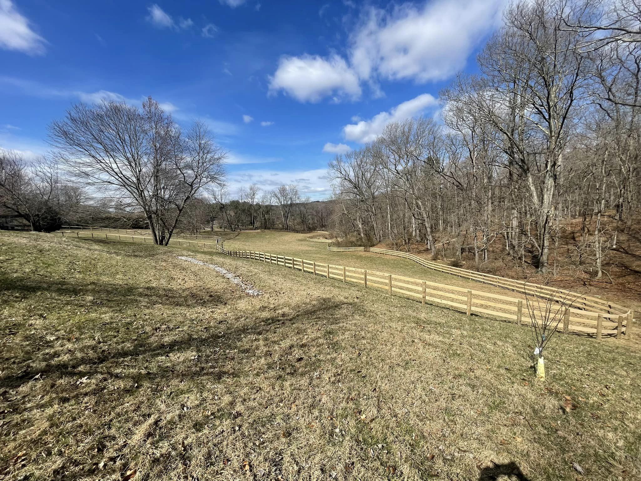 New farm fence installation by Oak and Iron Farm Fence